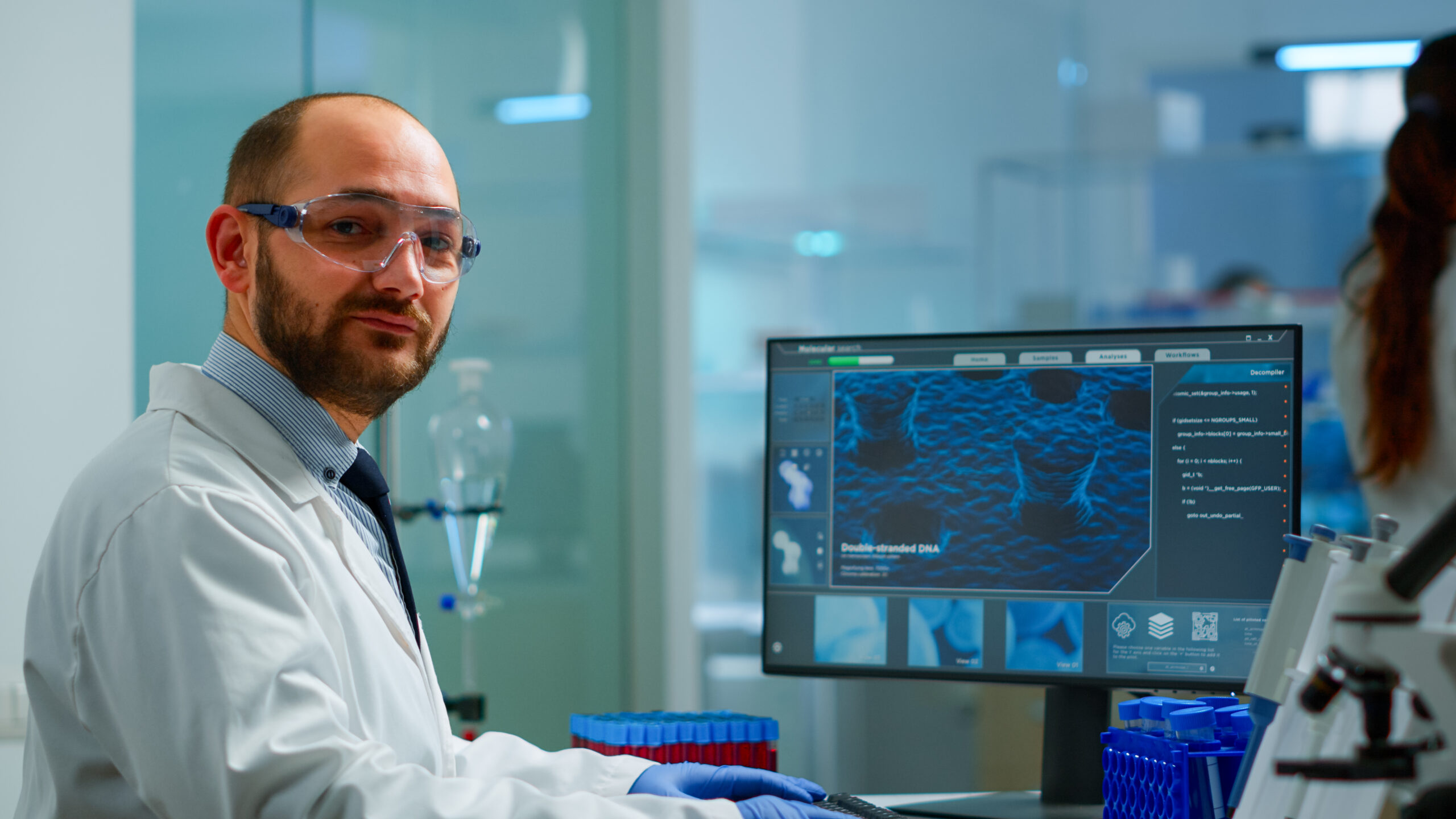 Portrait of scientist man looking at camera