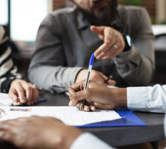 Black person signing job contract