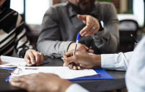 Black person signing job contract