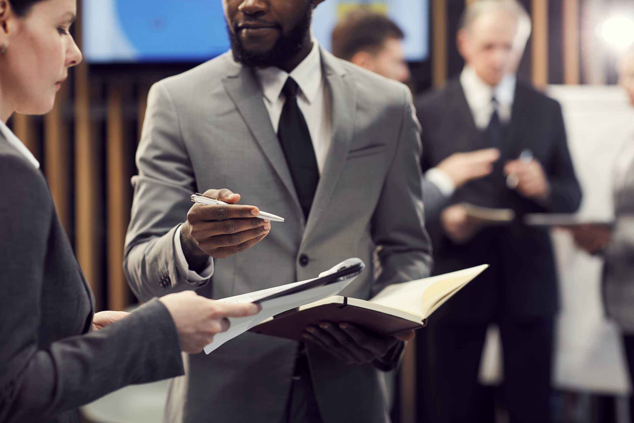Business forum participants communicating during break