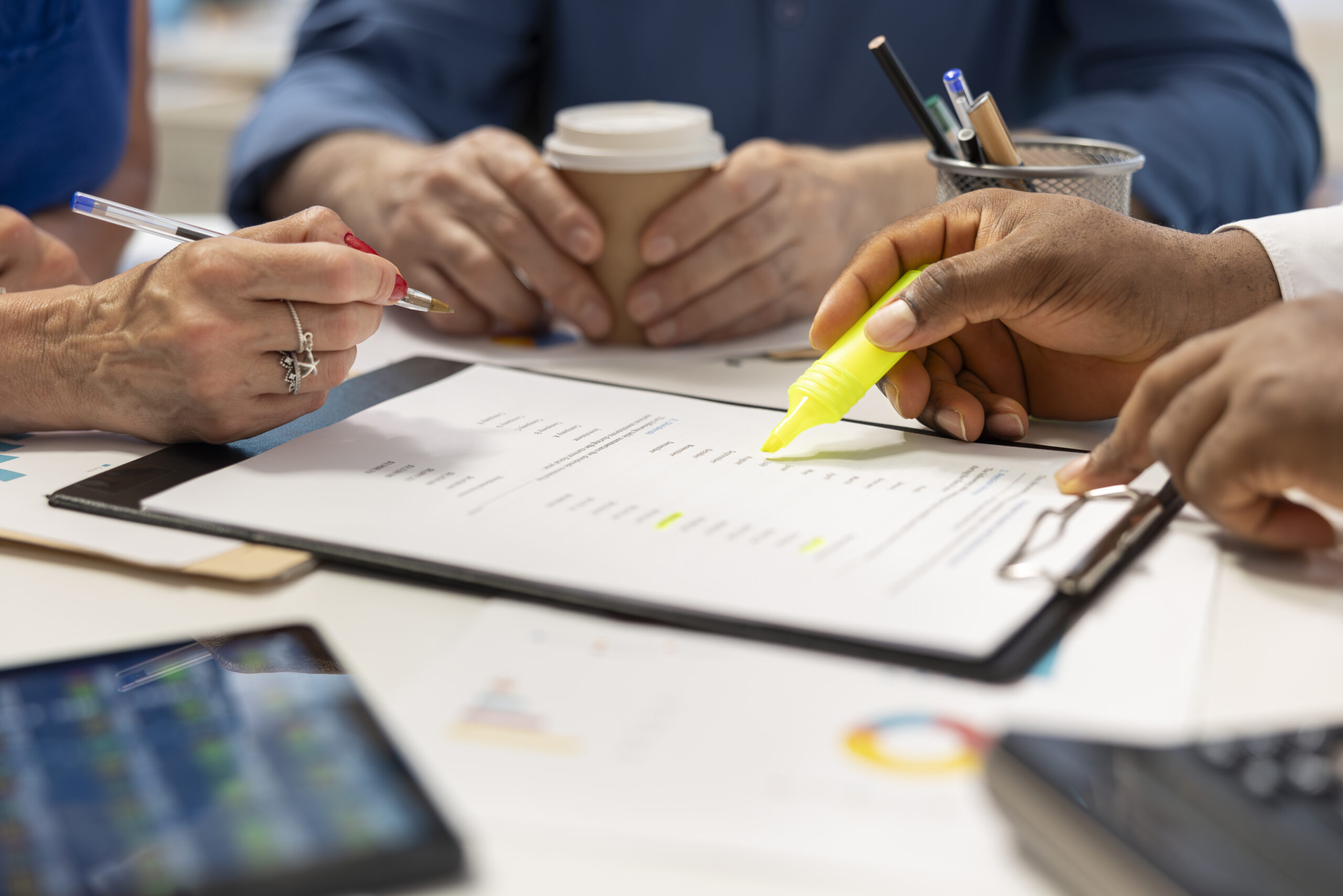 Financial planner expert highlighting contract terms for detailed retirement plan