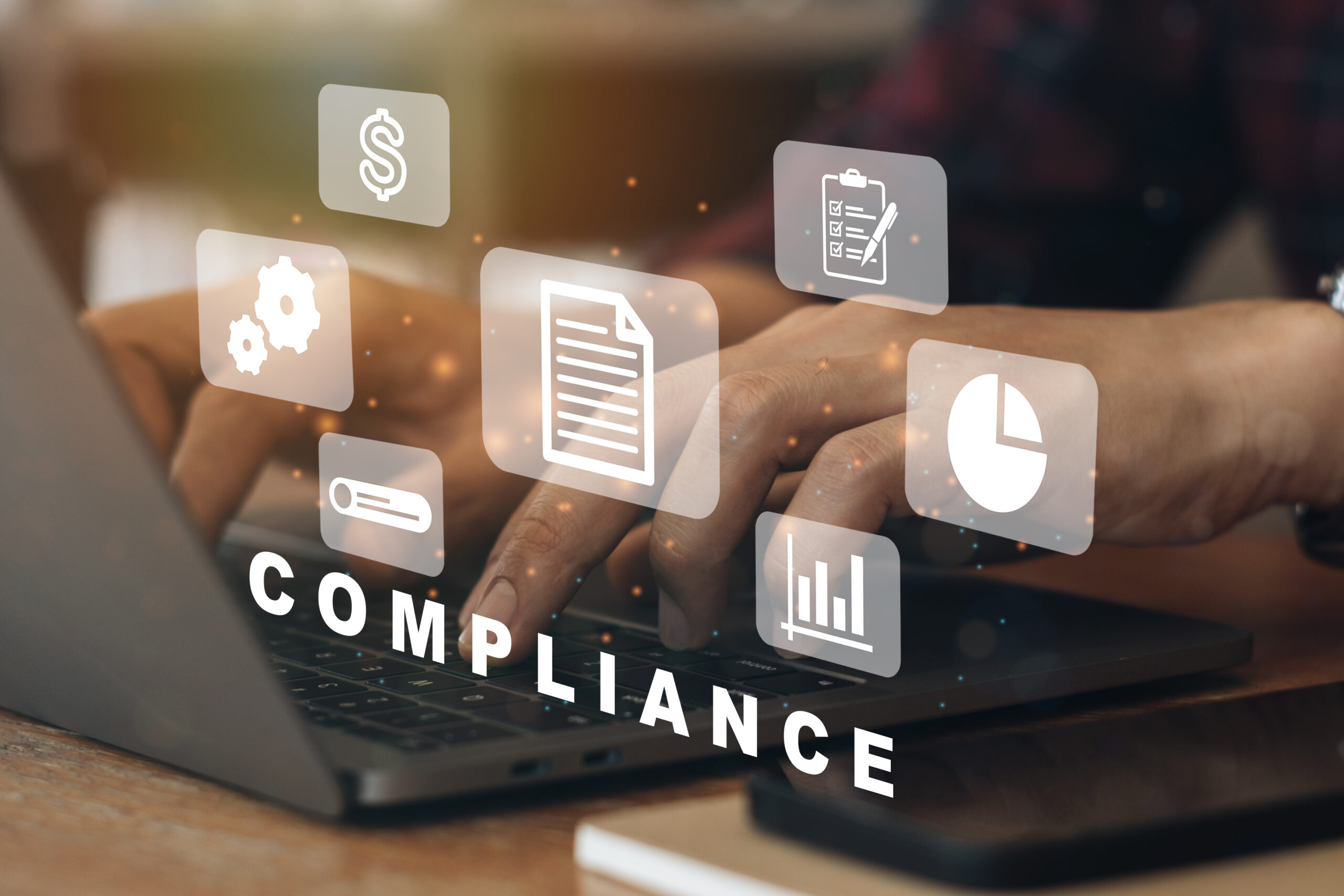 Person working on computer with icons of Compliance Rules Law Re